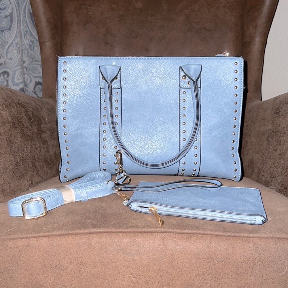 Light Blue Purse, with Brass Studs on front. 10” H x 5” W x 13 1/2” L